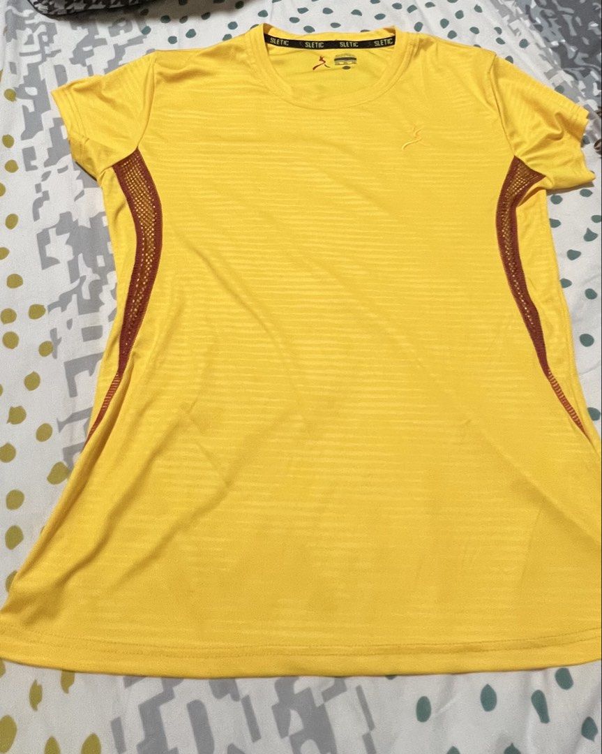 SLETIC Yellow Athletic T-shirt Size M (Category: Tshirts & Polo Shirts ) located in Antipolo. Submitted by murapod2 (Listing ID 1451529856, Image 2). Description: - Brand: SLETIC - Color: Yellow - Size: M - Design: Striped pattern on front and back - Features: Breathable mesh side panels - Sleeves: Short sleeves - Neckline: Crew neck - Ideal for: Workouts, athletic activities, casual wear.