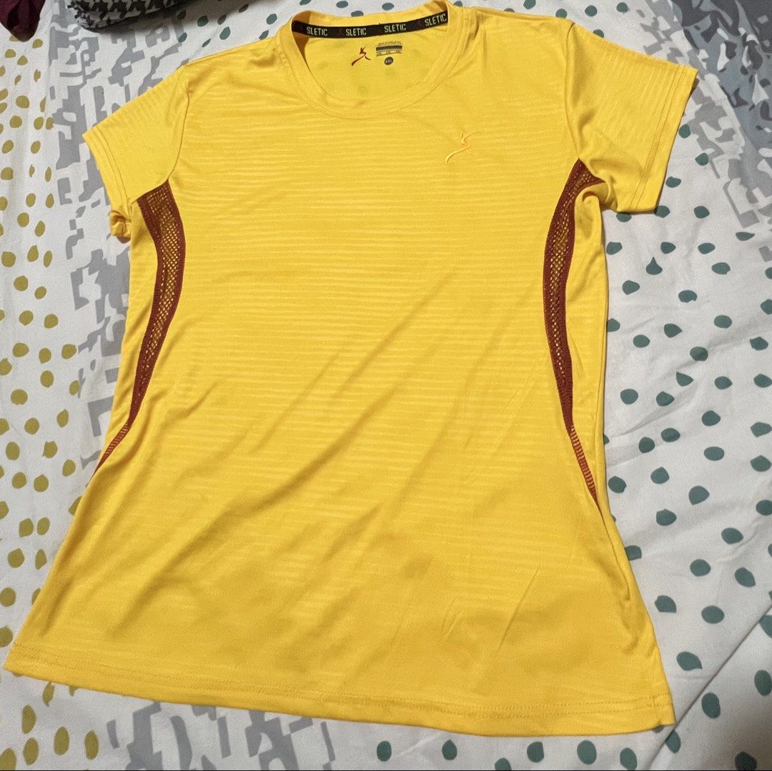 SLETIC Yellow Athletic T-shirt Size M (Category: Tshirts & Polo Shirts ) located in Antipolo. Submitted by murapod2 (Listing ID 1451529856, Image 1). Description: - Brand: SLETIC - Color: Yellow - Size: M - Design: Striped pattern on front and back - Features: Breathable mesh side panels - Sleeves: Short sleeves - Neckline: Crew neck - Ideal for: Workouts, athletic activities, casual wear.
