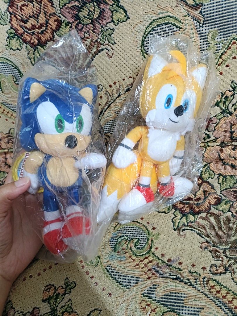Sonic the Hedgehog & Tails Plush Toys Set (Category: Plushies & Soft Toys) located in Baguio. Submitted by jamela.joy.shoppe15 (Listing ID 1451659671, Image 1). Description: - Set includes Sonic the Hedgehog and Tails plush toys. - Both are brand new and still in their original packaging. - Soft and cuddly, perfect for display or play. - Ideal for any Sonic fan or collector. - Get both iconic characters together!.