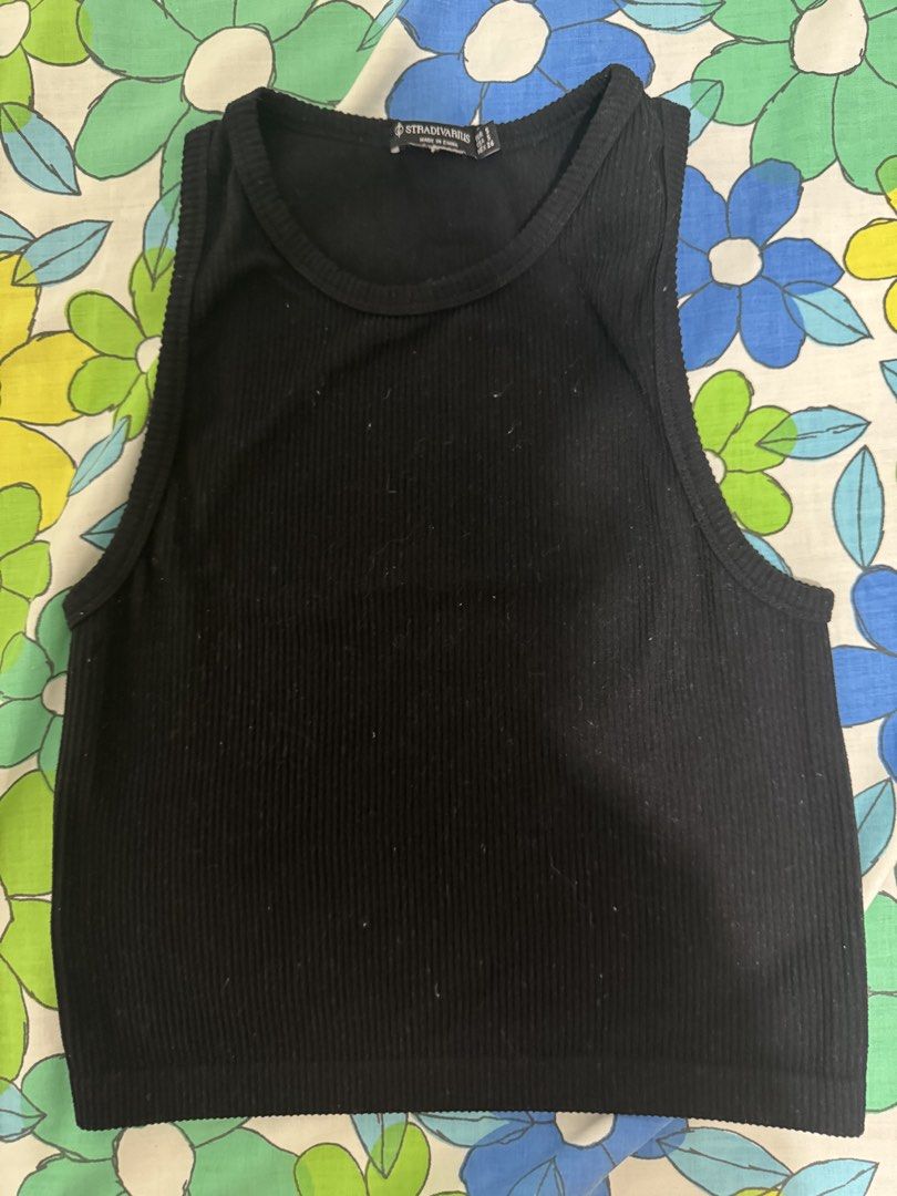 Stradivarius Black Ribbed Racerback Crop Top Size S (Category: Sleeveless) located in Pasig City. Submitted by theresebp (Listing ID 1451625408, Image 1). Description: - Stradivarius black ribbed crop top - Racerback style - Stretchy material - Best fits size S - Perfect wardrobe basic, easy to style.