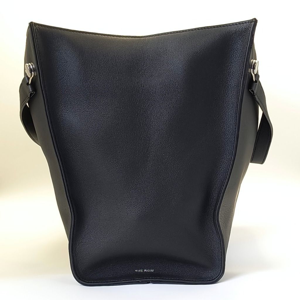The Row Alexia Tote Bag Black (Category: Luxury Bags & Wallets) located in Cebu City. Submitted by theluxxaffair (Listing ID 1451605352, Image 2). Description: Authentic The Row Alexia tote bag in black calfskin leather. A minimalist structured silhouette with soft curves and polished silver-tone hardware, finished with an understated yet quietly luxurious feel. Features a spacious interior with a detachable leather zip pouch included. Elegant an