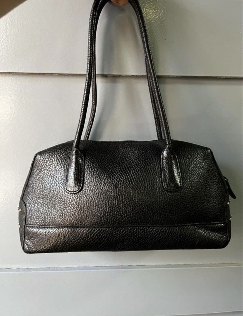 Authentic TOD'S Black Leather Studded Shoulder Bag (Category: Luxury Bags & Wallets) located in Quezon City. Submitted by ashi_shop (Listing ID 1451631832, Image 3). Description: - Authentic TOD’S black leather shoulder bag - Features pebbled leather texture - Stylish silver stud details on sides - Secure zipper closure - Comfortable shoulder straps for easy carrying - Ideal for everyday use -Very classy design -In very good condition, with minim