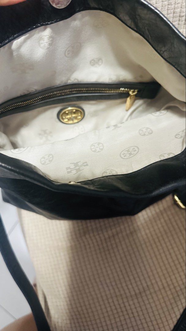 Tory Burch Black Leather Foldover Crossbody Bag (Category: Luxury Bags & Wallets) located in Manila. Submitted by preloved.brand2023 (Listing ID 1451679040, Image 3). Description: - Authentic Black Leather Tory Burch Bag - Stylish Foldover Design with Secure Snap Closure - Elegant Gold Hardware Accents - Interior Zippered Pocket and Signature Tory Burch Lining - Adjustable Crossbody Strap for Comfort - Ideal for Everyday Use and Carrying Essentia