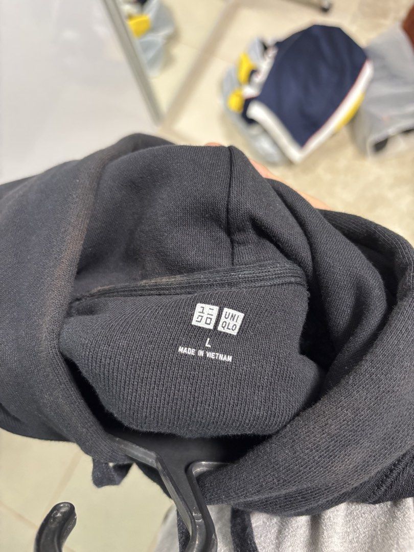 Uniqlo Black Hoodie (Category: Coats, Jackets and Outerwear) located in San Fernando. Submitted by blique2018 (Listing ID 1451653409, Image 3). Description: - Uniqlo Black Boxy Hoodie - Size: L - Dimes: 21x25 - Condition: 7/10, with brown discoloration on the collar and hoodie area - Shipping: via Lalamove / Grab (Shouldered by the buyer); Can go for meetup near UST - MOP: BDO/Gcash - RFS: Decluttering.
