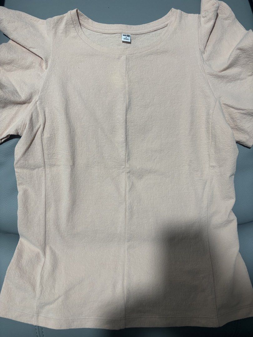 Uniqlo Puff Sleeve Top Size S (Category: Blouses) located in Manila. Submitted by jing3021 (Listing ID 1451535824, Image 1). Description: - Light pink Uniqlo top - Short puff sleeves - Textured fabric - Simple round neckline - Versatile for casual or dressed-up occasions - Fits true to size.