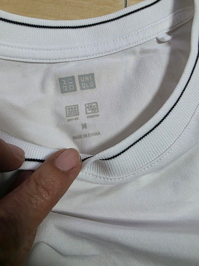 Two Uniqlo T-shirts (Navy blue & White) (Category: Shirts) located in Makati City. Submitted by shopdoc (Listing ID 1451639874, Image 2). Description: - Set of 2 Uniqlo T-shirts - Size: Medium (M) - Colors: 1 Navy blue, 1 White - Black T-shirt Features: DRY-EX, STRETCH - Ideal for everyday wear, layering, or as a standalone piece - Material: Made in China rfs decluttering selling as bundle for faster disposal.