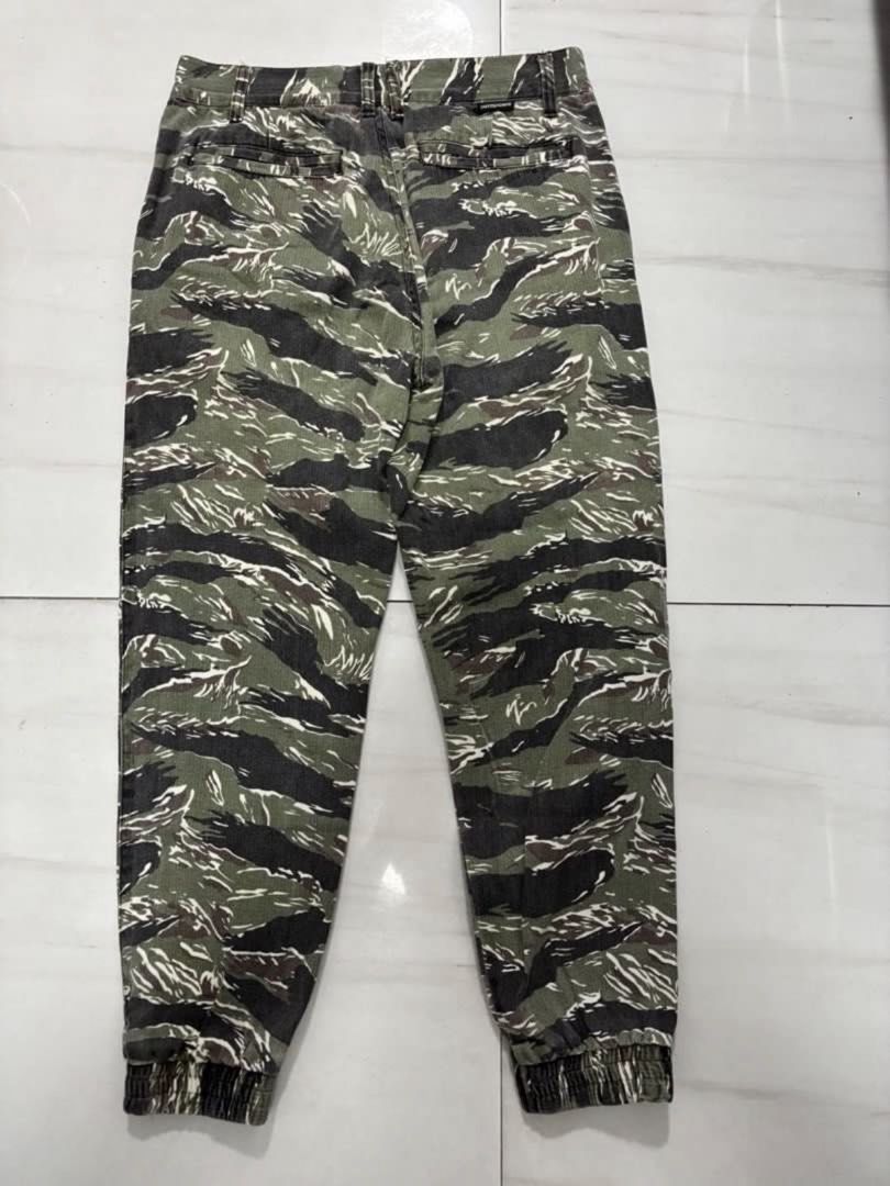 Untouched Tiger Camo Jogger Pants Size M (Category: Joggers) located in Quezon City. Submitted by edether (Listing ID 1451630359, Image 2). Description: - Brand: Untouched - Style: Tiger Camo Joggers - Size: Medium (M) - Features: Elasticated cuffs - Ideal for: Casual wear - Unique design: Stand out with the tiger camouflage pattern UNISEX Waist - 30in Length- 36in If you see it posted, it’s available. Last price and details are posted. No reply 