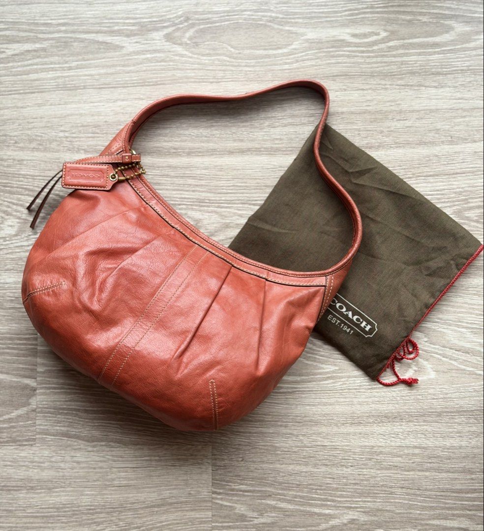 Vintage Coach Ergo Leather Pleated Medium Hobo 12235 (Terracotta / Rust) + Dust Bag⁠ (Category: Bags & Wallets) located in Kuala Lumpur. Submitted by shopfoundandloved (Listing ID 1451529783, Image 1). Description: Selling an authentic Coach Ergo Pleated Hobo from the 2008 collection in a gorgeous terracotta/burnt orange full-grain leather! A true Y2K archival piece in remarkable vintage condition. Brand / Model: Coach Ergo Pleated Hobo Style Ser