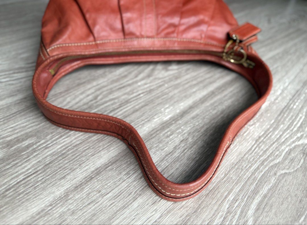 Vintage Coach Ergo Leather Pleated Medium Hobo 12235 (Terracotta / Rust) + Dust Bag⁠ (Category: Bags & Wallets) located in Kuala Lumpur. Submitted by shopfoundandloved (Listing ID 1451529783, Image 2). Description: Selling an authentic Coach Ergo Pleated Hobo from the 2008 collection in a gorgeous terracotta/burnt orange full-grain leather! A true Y2K archival piece in remarkable vintage condition. Brand / Model: Coach Ergo Pleated Hobo Style Ser