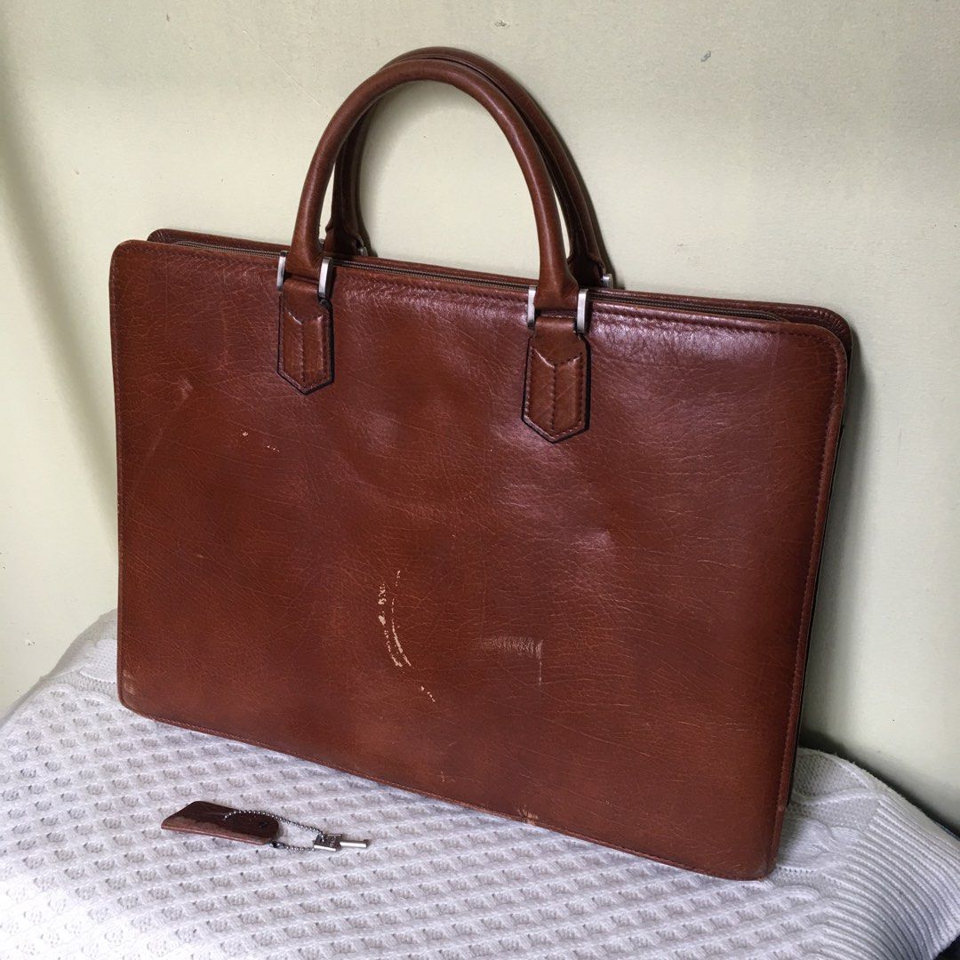 Vintage Genuine Leather Document Briefcase / Executive Folio Bag (Category: Luxury Bags & Wallets) located in Makati City. Submitted by tasteofluxury (Listing ID 1451659578, Image 3). Description: Vintage Genuine Leather Document Briefcase / Executive Folio Bag Up for sale is a premium vintage executive briefcase crafted from high-quality, rich cognac brown genuine leather with a beautiful natural patina. Perfect for professionals, law/business s