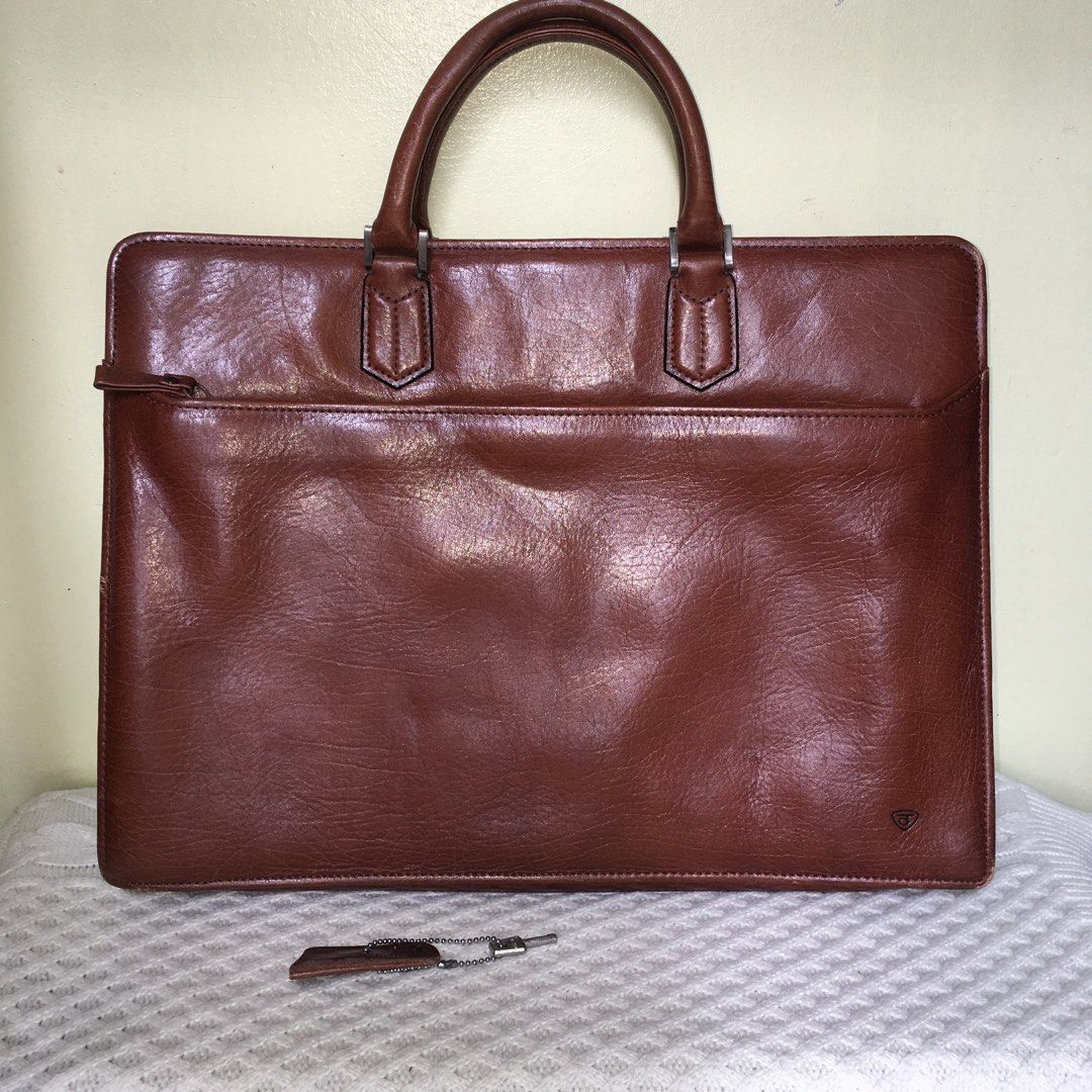 Vintage Genuine Leather Document Briefcase / Executive Folio Bag (Category: Luxury Bags & Wallets) located in Makati City. Submitted by tasteofluxury (Listing ID 1451659578, Image 2). Description: Vintage Genuine Leather Document Briefcase / Executive Folio Bag Up for sale is a premium vintage executive briefcase crafted from high-quality, rich cognac brown genuine leather with a beautiful natural patina. Perfect for professionals, law/business s