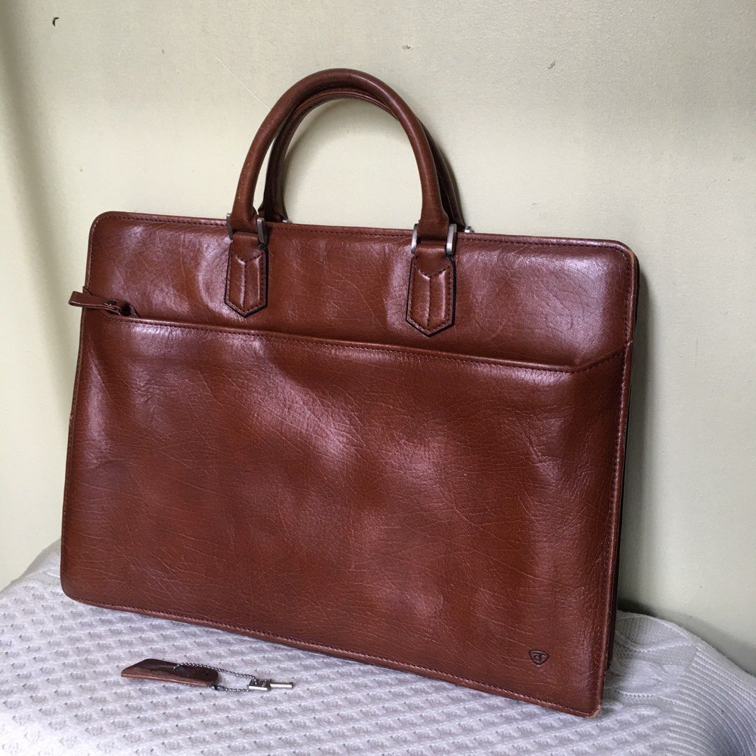 Vintage Genuine Leather Document Briefcase / Executive Folio Bag (Category: Luxury Bags & Wallets) located in Makati City. Submitted by tasteofluxury (Listing ID 1451659578, Image 1). Description: Vintage Genuine Leather Document Briefcase / Executive Folio Bag Up for sale is a premium vintage executive briefcase crafted from high-quality, rich cognac brown genuine leather with a beautiful natural patina. Perfect for professionals, law/business s