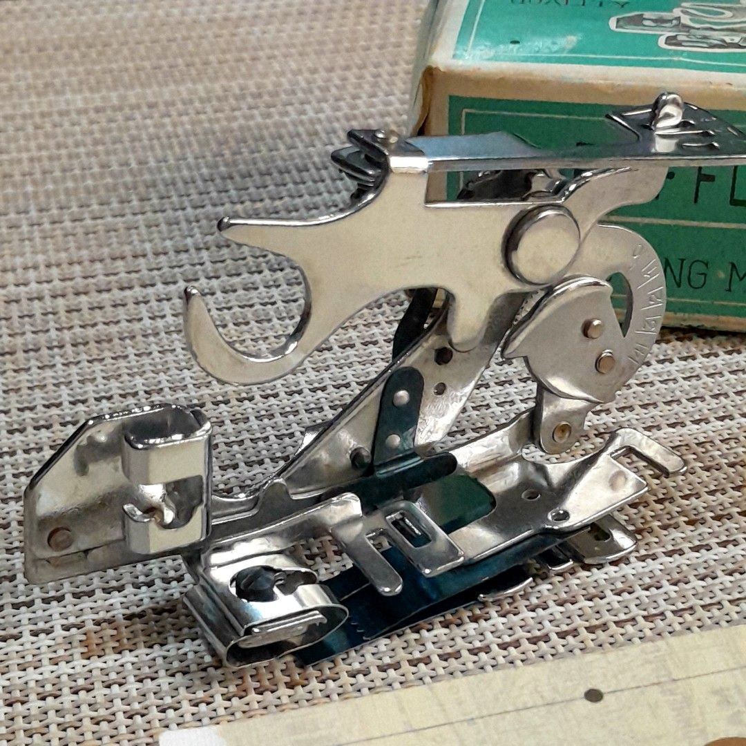 Vintage Singer Ruffler Foot (Category: Craft Supplies & Tools) located in Las Pinas. Submitted by 84vintage (Listing ID 1451563223, Image 3). Description: This is a vintage Singer Ruffler Foot, model 55705, designed for low-shank sewing machines to create even ruffles and gathers. Includes specialized adjustable blades for creating folds and crumples. Actual photos posted. Please examine them carefully as they are part of the description. --📌 MU