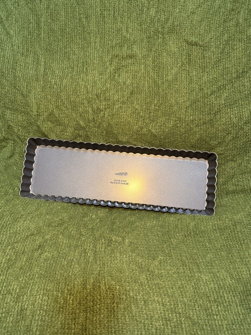Wilton Rectangular Tart Pan with Removable Bottom (Category: Cookware & Accessories) located in Manila. Submitted by georgethjafine (Listing ID 1451689125, Image 1). Description: - Rectangular tart pan - Fluted edge design - Dimensions: 10 x 3.5 inches - Non-stick surface for easy release - Ideal for baking quiches and tarts - Simple to use and clean.