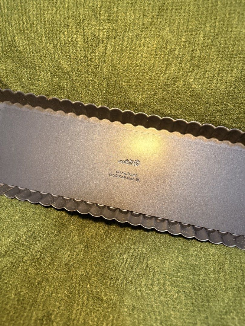 Wilton Rectangular Tart Pan with Removable Bottom (Category: Cookware & Accessories) located in Manila. Submitted by georgethjafine (Listing ID 1451689125, Image 3). Description: - Rectangular tart pan - Fluted edge design - Dimensions: 10 x 3.5 inches - Non-stick surface for easy release - Ideal for baking quiches and tarts - Simple to use and clean.