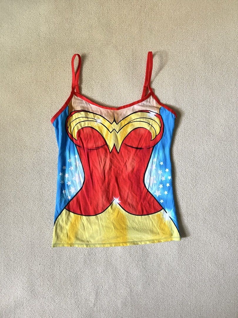 Wonderwoman graphic top (Category: Others Tops) located in Quezon City. Submitted by y2klar (Listing ID 1451610501, Image 1). Description: Wonderwoman graphic tee Size-Small-Medium 10/10 condition no flaws..