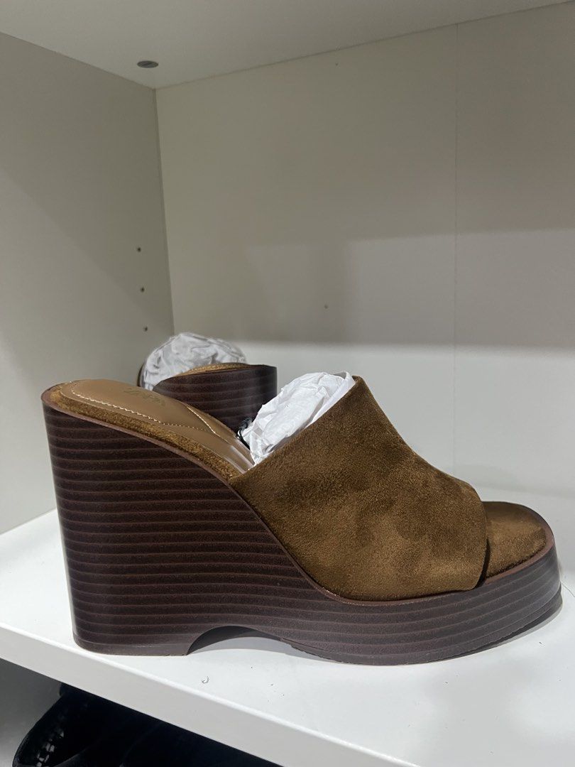 Zara Brown Suede Platform Wedge Sandals Size 37 (Category: Wedges) located in Taguig. Submitted by strutstella (Listing ID 1451561699, Image 3). Description: - Brand: Zara - Color: Brown - Material: Suede - Style: Platform Wedge Sandals - Toe: Square Toe - Heel: Comfortable Wedge - Size: 37 - Condition: Brand new, never worn, with tags attached - Versatile: Perfect for dressing up or down Impulse buy .
