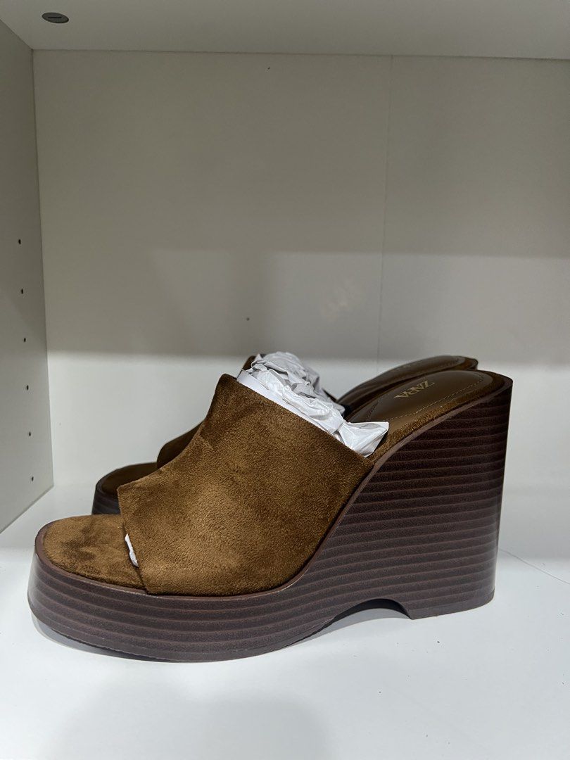 Zara Brown Suede Platform Wedge Sandals Size 37 (Category: Wedges) located in Taguig. Submitted by strutstella (Listing ID 1451561699, Image 2). Description: - Brand: Zara - Color: Brown - Material: Suede - Style: Platform Wedge Sandals - Toe: Square Toe - Heel: Comfortable Wedge - Size: 37 - Condition: Brand new, never worn, with tags attached - Versatile: Perfect for dressing up or down Impulse buy .
