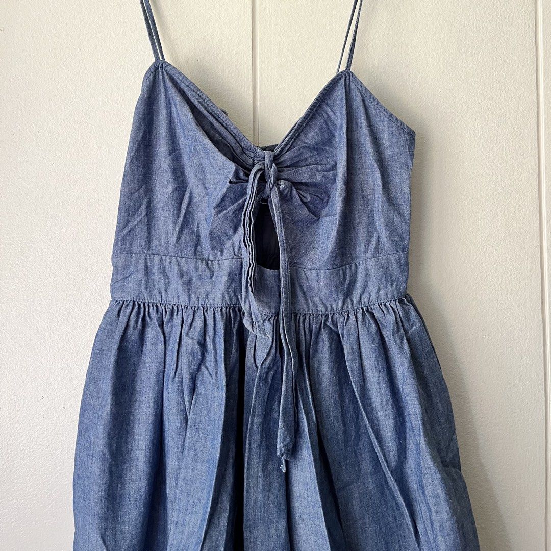 Zara Denim Blue Dress (Category: Dresses) located in Quezon City. Submitted by nchm88 (Listing ID 1451543508, Image 1). Description: Really pretty Zara denim dress - zipper closure at the back - thin adjustable shoulder straps - ribbon tie detail in front - soft denim fabric - below the knee length - used a few times, less than 5 times only, still good as new, no issues or damages - size xs/s - no when worn photo since this does not fit me anymor