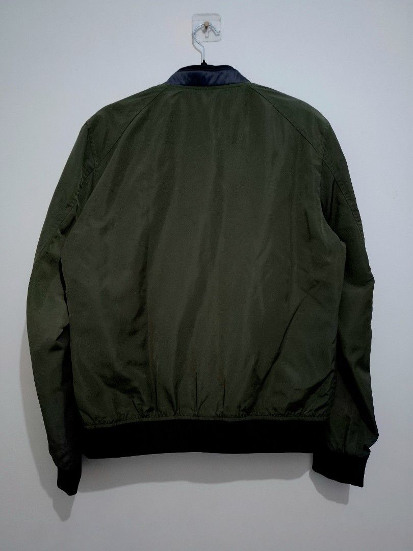 Zara Man - Olive Green Bomber Jacket (Category: Coats, Jackets and Outerwear) located in Cabuyao City. Submitted by tav.s (Listing ID 1451647211, Image 2). Description: Zara Man Olive Green Bomber Jacket Details: Brand: Zara Man Color: Olive Green Style: Bomber Jacket Full front zipper Side pockets Good preloved condition Measurements: Size - XL on tag Shoulder width : 19 inches Sleeve length : 25.5 inches Chest : 23.5 inches Body Length : 26.5 i