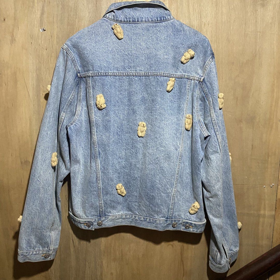 13DE MARZO PARIS Denim Jacket with Teddy Bear Embellishments (Category: Coats, Jackets and Outerwear) located in Manila. Submitted by drp4drp (Listing ID 1451840231, Image 2). Description: Dimes: Length 25 Width 21.5 shoulder to wrist 27 wrist hem 6 In very good condition Just need wash - 13DE MARZO PARIS denim jacket - Features a fun, all-over teddy bear print - Classic button-up front closure - Two chest pockets for convenience - A unique and e