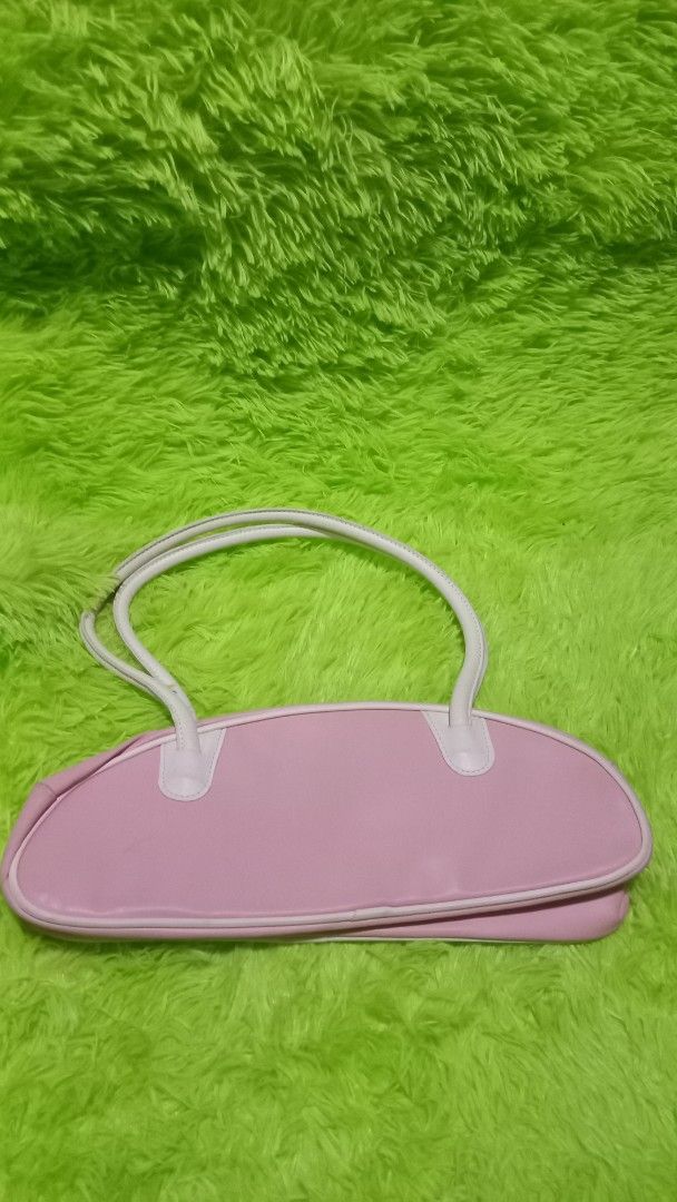 3CE Stylenanda Pink Shoulder Bag Y2K Style (Category: Shoulder Bags) located in Manila. Submitted by twinklelyn03 (Listing ID 1451769391, Image 3). Description: - Cute pink shoulder bag from 3CE Stylenanda - Trendy Y2K style - Bowling bag shape - White handles and trim - Zipper closure - Ideal for carrying essentials - Great for casual day outs see photos for details pm sa sure buyer only thank you so much po!.