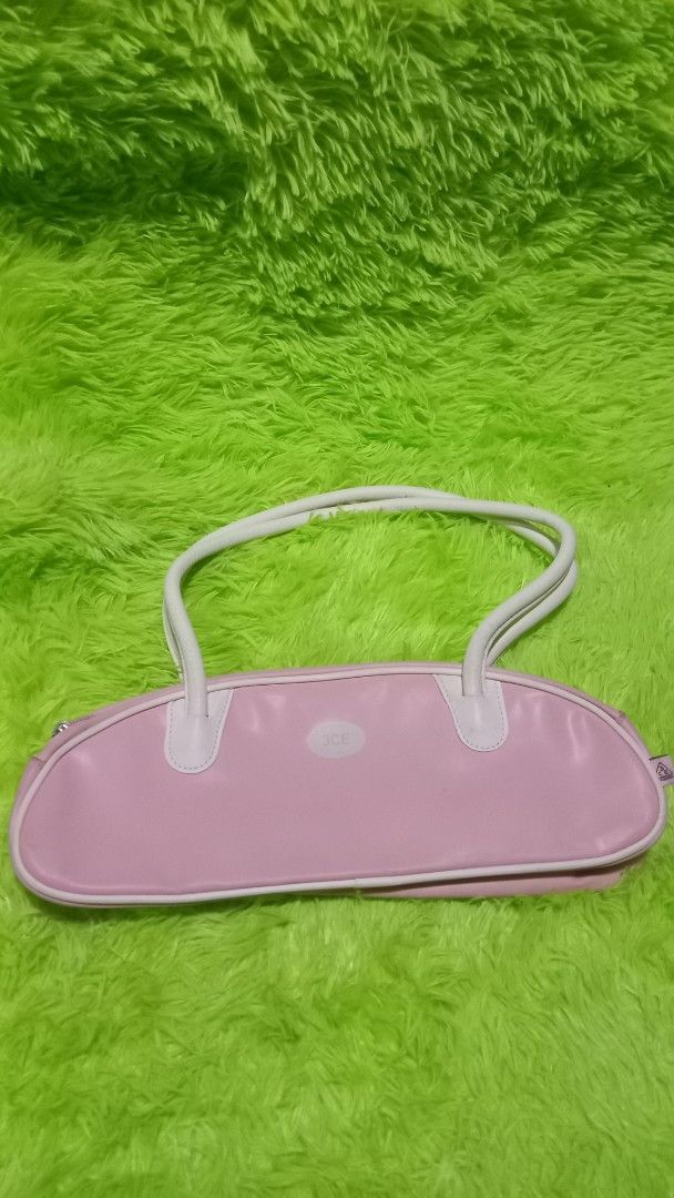 3CE Stylenanda Pink Shoulder Bag Y2K Style (Category: Shoulder Bags) located in Manila. Submitted by twinklelyn03 (Listing ID 1451769391, Image 2). Description: - Cute pink shoulder bag from 3CE Stylenanda - Trendy Y2K style - Bowling bag shape - White handles and trim - Zipper closure - Ideal for carrying essentials - Great for casual day outs see photos for details pm sa sure buyer only thank you so much po!.
