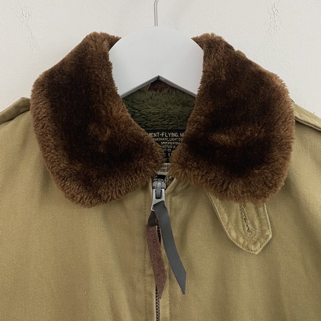 3-DAYS UNION B-10 Flight Jacket (Category: Coats, Jackets and Outerwear) located in Cavite. Submitted by mana__ (Listing ID 1451878040, Image 3). Description: - Khaki bomber jacket - Detachable brown fur collar - Fuzzy green lining - Two front flap pockets with button closure - 'Army Air Forces' patch on left sleeve - Zipper closure with leather pull tab - Ribbed cuffs and hem - Small on tag Xs frame Width - 18.8 Length - 23 Shoulders - 25 Sleeve