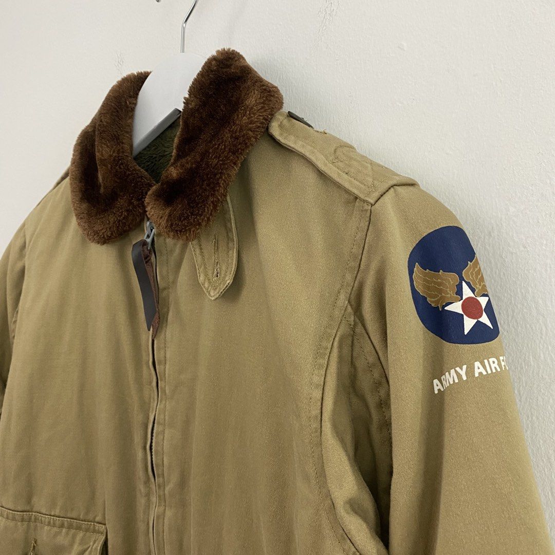3-DAYS UNION B-10 Flight Jacket (Category: Coats, Jackets and Outerwear) located in Cavite. Submitted by mana__ (Listing ID 1451878040, Image 2). Description: - Khaki bomber jacket - Detachable brown fur collar - Fuzzy green lining - Two front flap pockets with button closure - 'Army Air Forces' patch on left sleeve - Zipper closure with leather pull tab - Ribbed cuffs and hem - Small on tag Xs frame Width - 18.8 Length - 23 Shoulders - 25 Sleeve