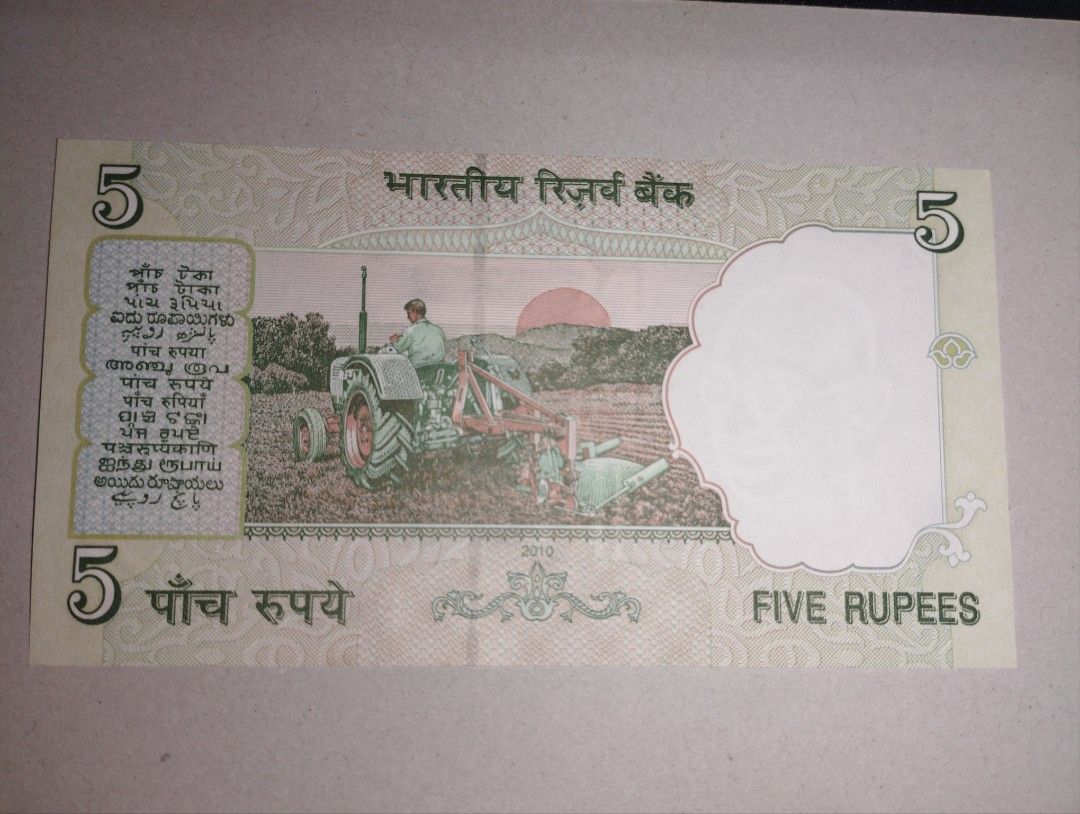India 5 Rupees (Category: Currency) located in Baguio. Submitted by maximum_carnage (Listing ID 1451799663, Image 2). Description: - Authentic 5 Rupees banknote from India - Dated 2010 - Features Mahatma Gandhi on one side - Depicts a tractor in a field on the reverse - Ideal for coin and banknote collectors - Unique decorative piece.