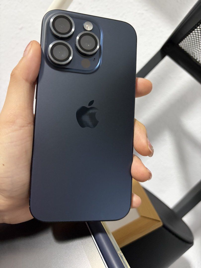 (Category: iPhone 15 Series) located in Singapore. Submitted by ultraviolt (Listing ID 1400417451, Image 3). Description: - Midnight Blue iPhone - Includes original box and accessories - Minor Scratches - LCD has a thin line across. Fully functionable.