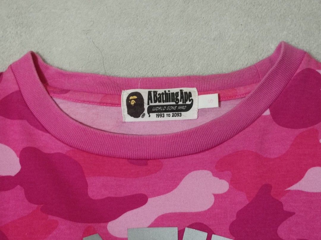 A Bathing Ape Pink Camo Bape Tee (Category: Tshirts & Polo Shirts ) located in Solano. Submitted by andrewfrancisco2.0 (Listing ID 1451887202, Image 2). Description: A Bathing Ape Pink Camo Bape Tee SIZE SMALL ON TAG ISSUE/S ‼️: MINIMAL CRACKPRINTS FRONT PRINT DESIGN COLOR RATE 9/10 CONDITION 9/10 P1800 PLUS SF DIMENSIONS W 22 L 23 NUEVA VIZCAYA LOC 📍 MODE OF PAYMENT THROUGH GCASH PAYMENT FIRST NO COD CAN DO VC/ PICTURE WITH THE ITEM PM NALANG P
