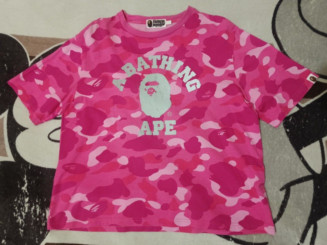 A Bathing Ape Pink Camo Bape Tee (Category: Tshirts & Polo Shirts ) located in Solano. Submitted by andrewfrancisco2.0 (Listing ID 1451887202, Image 1). Description: A Bathing Ape Pink Camo Bape Tee SIZE SMALL ON TAG ISSUE/S ‼️: MINIMAL CRACKPRINTS FRONT PRINT DESIGN COLOR RATE 9/10 CONDITION 9/10 P1800 PLUS SF DIMENSIONS W 22 L 23 NUEVA VIZCAYA LOC 📍 MODE OF PAYMENT THROUGH GCASH PAYMENT FIRST NO COD CAN DO VC/ PICTURE WITH THE ITEM PM NALANG P