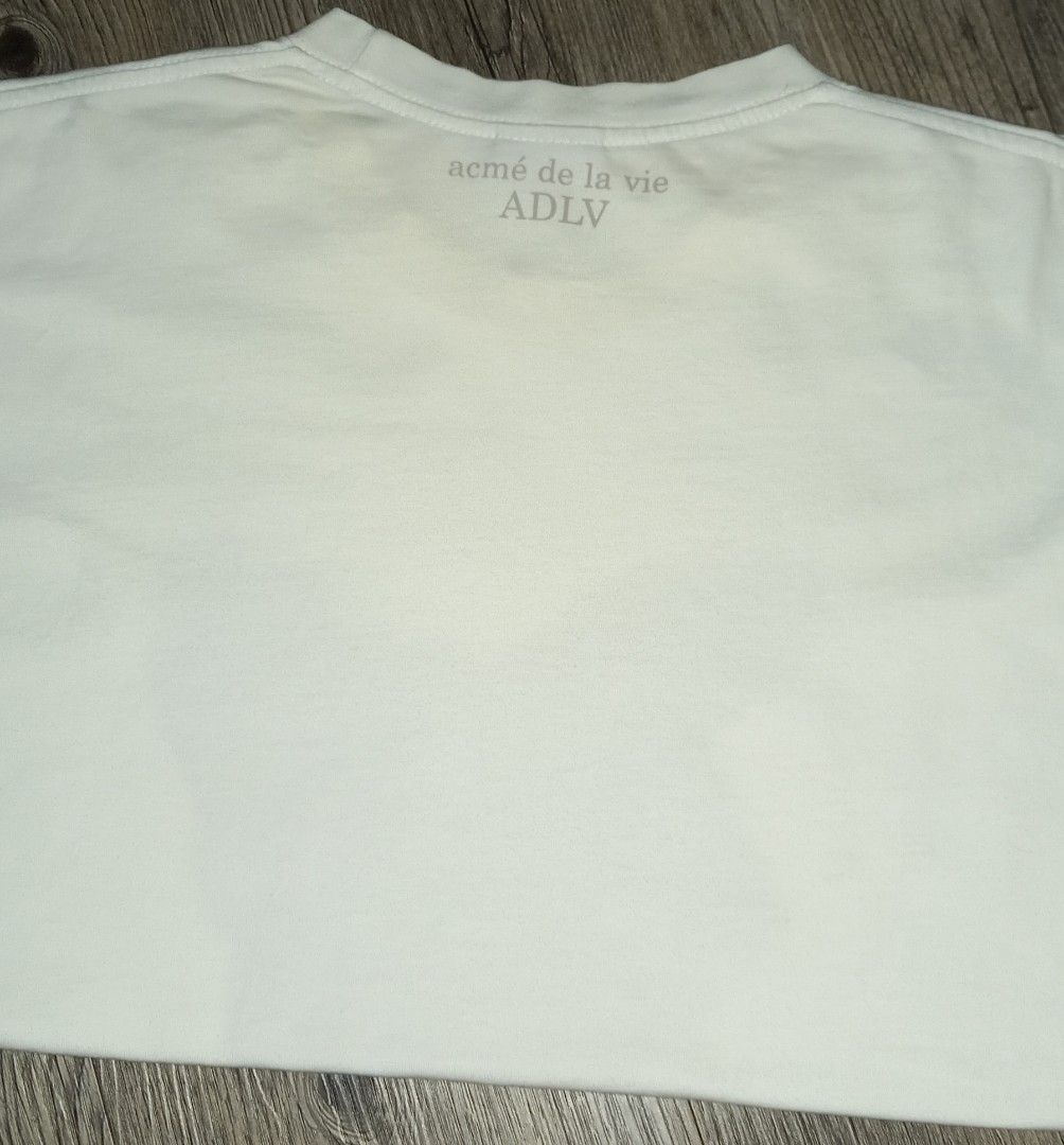 Acme de la vie ADLV White Bunny (Category: Tshirts & Polo Shirts ) located in Imus. Submitted by pampie (Listing ID 1451850869, Image 2). Description: - White ADLV T-shirt - Adorable bunny graphic on front - Size: L-XL - Measurements: 22 inches (width) x 28 inches (length) - Minor yellow stain on neck area (please check photos) - Sold as is.