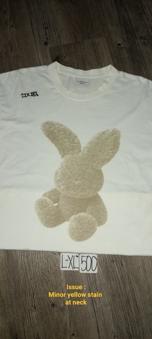 Acme de la vie ADLV White Bunny (Category: Tshirts & Polo Shirts ) located in Imus. Submitted by pampie (Listing ID 1451850869, Image 1). Description: - White ADLV T-shirt - Adorable bunny graphic on front - Size: L-XL - Measurements: 22 inches (width) x 28 inches (length) - Minor yellow stain on neck area (please check photos) - Sold as is.