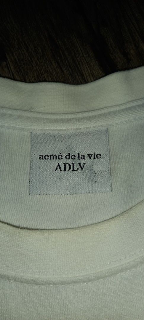 Acme de la vie ADLV White Bunny (Category: Tshirts & Polo Shirts ) located in Imus. Submitted by pampie (Listing ID 1451850869, Image 3). Description: - White ADLV T-shirt - Adorable bunny graphic on front - Size: L-XL - Measurements: 22 inches (width) x 28 inches (length) - Minor yellow stain on neck area (please check photos) - Sold as is.