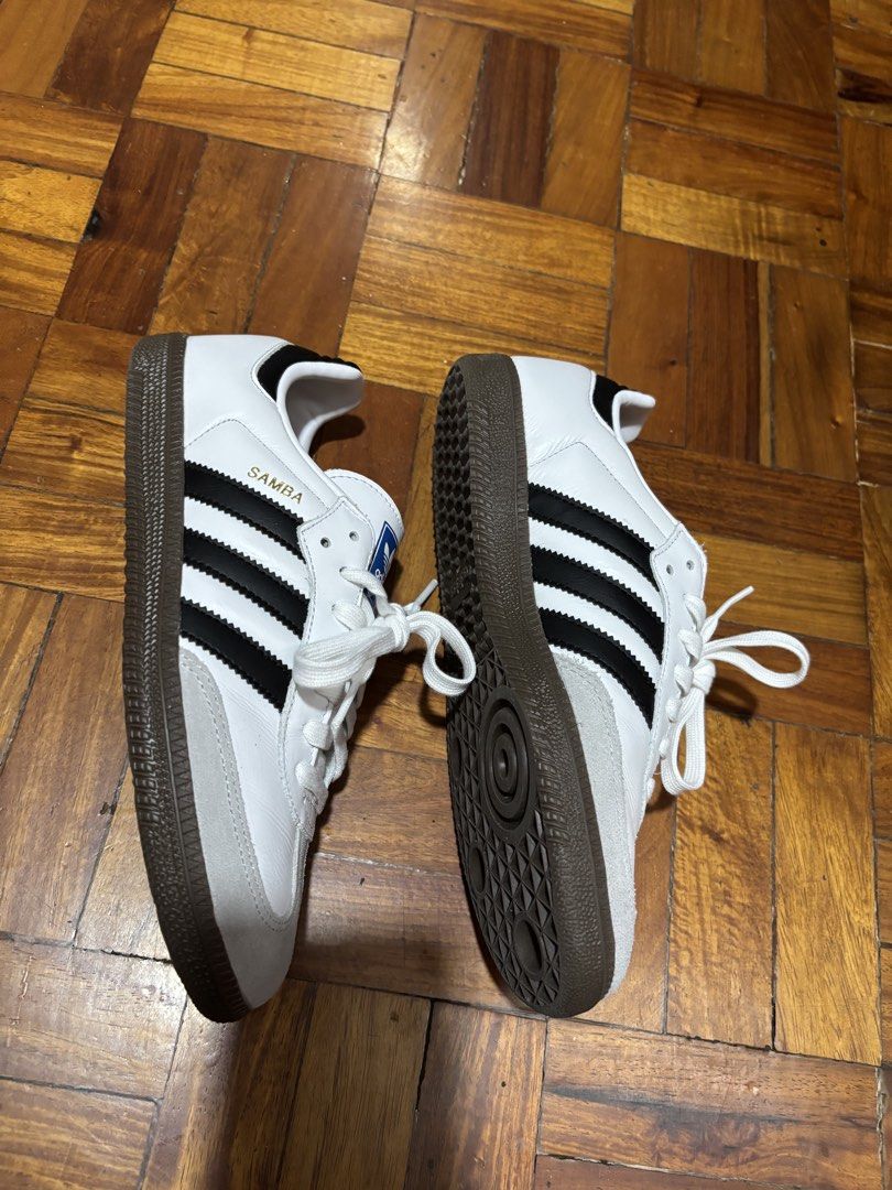 Adidas Samba OG White Black Gum Sole (Category: Sneakers) located in Mandaluyong City. Submitted by tahdig (Listing ID 1451782439, Image 3). Description: Classic Adidas Samba OG (Japan sourced). White leather, black stripes, grey suede toe, gum sole. Includes original box with tags. Perfect for casual or sporty style. RFS: Gifted to me but were too big .