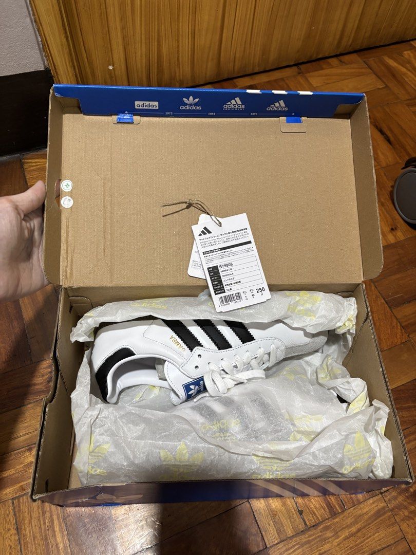 Adidas Samba OG White Black Gum Sole (Category: Sneakers) located in Mandaluyong City. Submitted by tahdig (Listing ID 1451782439, Image 2). Description: Classic Adidas Samba OG (Japan sourced). White leather, black stripes, grey suede toe, gum sole. Includes original box with tags. Perfect for casual or sporty style. RFS: Gifted to me but were too big .