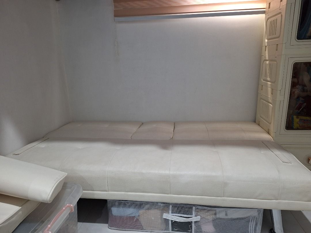 Aesthetic White Sofa Bed (Category: Sofas) located in Quezon City. Submitted by camille_cr (Listing ID 1451746145, Image 3). Description: Move-out price Purchased brand new last year White Fabric Sturdy sofa bed.