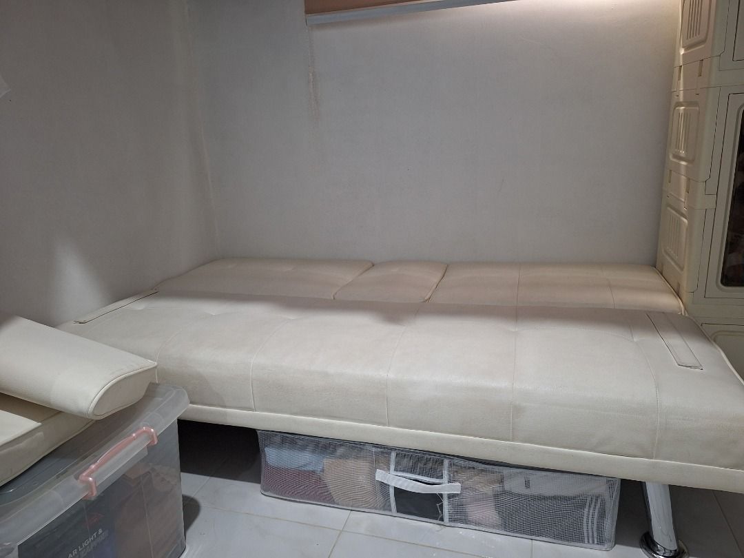Aesthetic White Sofa Bed (Category: Sofas) located in Quezon City. Submitted by camille_cr (Listing ID 1451746145, Image 2). Description: Move-out price Purchased brand new last year White Fabric Sturdy sofa bed.