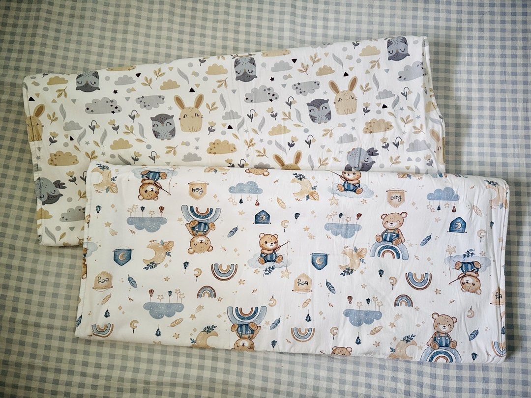 Aimerie waterproof bedpad (Category: Changing Mats & Accessories) located in Taguig. Submitted by lizzzzzx (Listing ID 1451703014, Image 1). Description: - Set of 2 adorable pillowcases for baby's nursery. - Design 1: Cute woodland animals (bunnies, owls). - Design 2: Sweet pattern with teddy bears, rainbows, and moons. - Made with soft, cozy fabric. - Perfect for creating a comfortable nursery environment. - Makes a wonderful gift for baby showe
