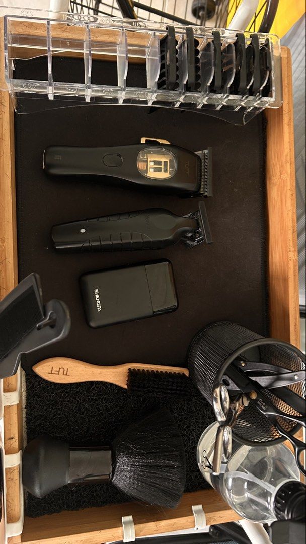 Assorted Barber Stuff (Category: Men's Grooming) located in Singapore. Submitted by oddcloud.7bda76 (Listing ID 1451748579, Image 1). Description: Assorted barber stuff pm for what u want 30cm ringlight x2 tuft vista c clipper shaver kemei trimmer black gloves crocodile clip fading brush hair brush shears water spray straight razor dusting fan combs mirror capes.