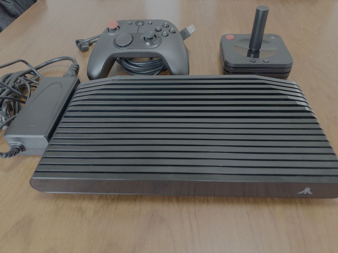 Atari VCS console w/ gamepad and joystick (Category: Others) located in Makati City. Submitted by device81 (Listing ID 1451741897, Image 1). Description: The Atari VCS is a modern retro-hybrid mini-PC and video game console inspired by the classic 1977 Atari 2600, featuring an AMD Ryzen processor, 8GB of upgradeable RAM, and 4K HDR video streaming. Unit bought via Atari's Kickstarter for $271. Photo of receipt provided. Hardware Specifications Pr