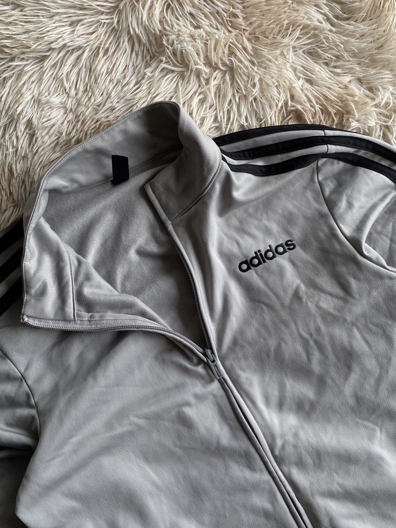 Authentic Adidas 3-Stripes Full-Zip Track Jacket - Heather Grey / Black ⚡️👟 (Category: Hoodies) located in Puerto Princesa. Submitted by thriftedheatshub (Listing ID 1451826801, Image 2). Description: DESCRIPTION: 📌 🔥 CLASSIC ATHLETIC / STREETWEAR TRACK JACKET DRIP! Up for grabs is an authentic Adidas Full-Zip Track Jacket in a clean grey and black contrast colorway. Features iconic 3-Stripes down the sleeves, embroidered Adidas chest logo, st