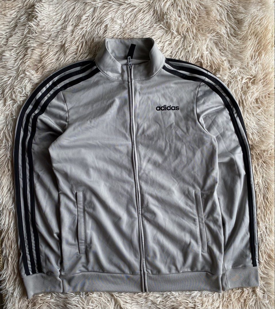 Authentic Adidas 3-Stripes Full-Zip Track Jacket - Heather Grey / Black ⚡️👟 (Category: Hoodies) located in Puerto Princesa. Submitted by thriftedheatshub (Listing ID 1451826801, Image 1). Description: DESCRIPTION: 📌 🔥 CLASSIC ATHLETIC / STREETWEAR TRACK JACKET DRIP! Up for grabs is an authentic Adidas Full-Zip Track Jacket in a clean grey and black contrast colorway. Features iconic 3-Stripes down the sleeves, embroidered Adidas chest logo, st