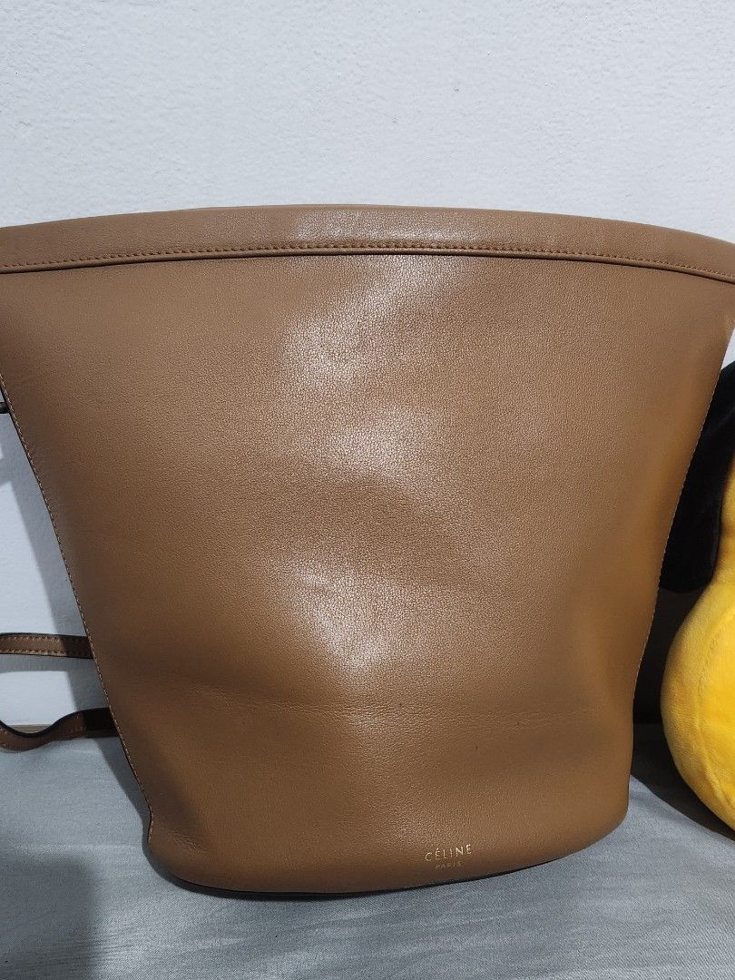 Authentic Celine Brown Leather Bucket Bag (Category: Luxury Bags & Wallets) located in Cainta. Submitted by pumbamnl (Listing ID 1451798794, Image 1). Description: - Authentic Celine brown leather bucket bag - Classic and timeless design - Ideal for everyday use Needs repair on stitch but still usable Please do not haggle. I do not have last price. This is so cheap na, pls google 2nd hand selling price. .