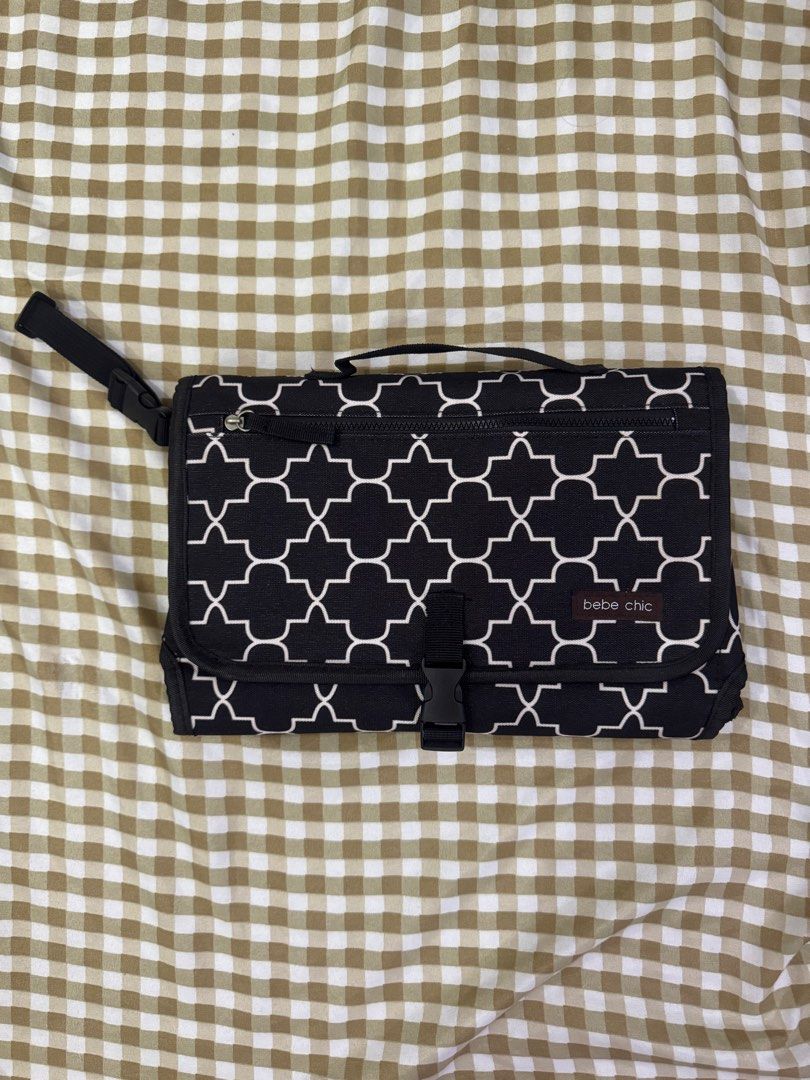 Bebe Chic Changing Pad Clutch Black White Geometric Pattern (Category: Changing Mats & Accessories) located in Manila. Submitted by hnsmktg (Listing ID 1451862487, Image 1). Description: - Bebe Chic changing pad clutch - Stylish black with white geometric pattern - Folds neatly for portability - Includes a padded changing mat - Perfect for diaper changes on the go.