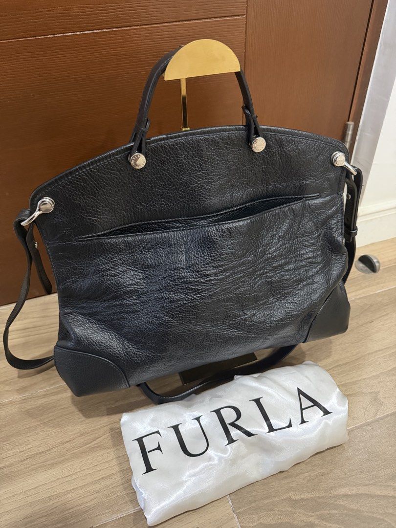 Black FURLA Large Piper in Distressed Leather (Category: Luxury Bags & Wallets) located in Santa Rosa. Submitted by jdoria (Listing ID 1451869723, Image 2). Description: - Genuine black leather Furla bag - Features comfortable top handles - Includes a detachable shoulder strap for versatile carrying - Lined with branded Furla fabric - Comes with the original Furla dust bag - Ideal for everyday style and practicality Authentic/Genuine Super clean 