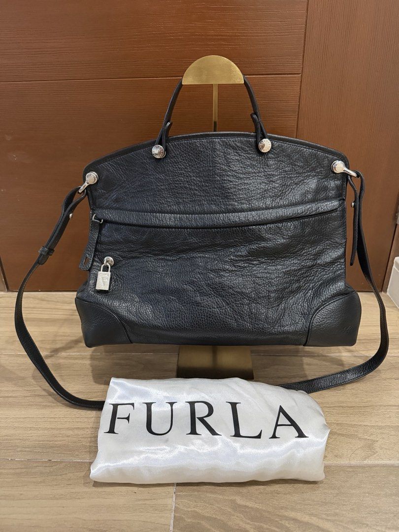Black FURLA Large Piper in Distressed Leather (Category: Luxury Bags & Wallets) located in Santa Rosa. Submitted by jdoria (Listing ID 1451869723, Image 1). Description: - Genuine black leather Furla bag - Features comfortable top handles - Includes a detachable shoulder strap for versatile carrying - Lined with branded Furla fabric - Comes with the original Furla dust bag - Ideal for everyday style and practicality Authentic/Genuine Super clean 