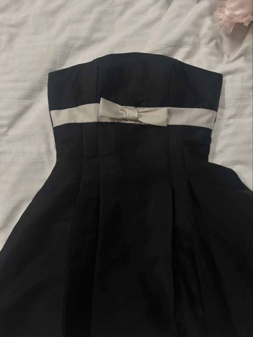 Black ribbon dress (Category: Dresses) located in Taguig. Submitted by chen.preloveddd (Listing ID 1451796175, Image 2). Description: - Can fit S-M frame - Waist 26-28 - Decluttering, no damages/stains 📍 Taguig south signal village Courier: Lalamove or jnt.